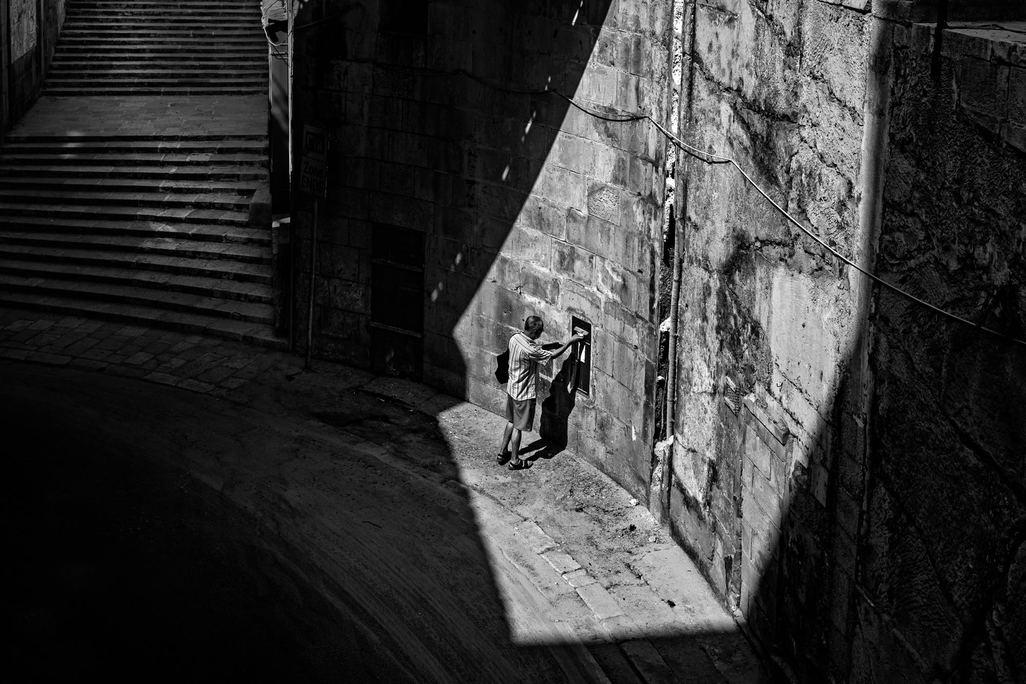 Posting a letter in the shadow of Victoria Gate, Valletta